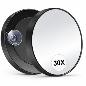Twee zwarte ronde spiegels met 30x vergroting en een transparante zuignap op de achterzijde.
